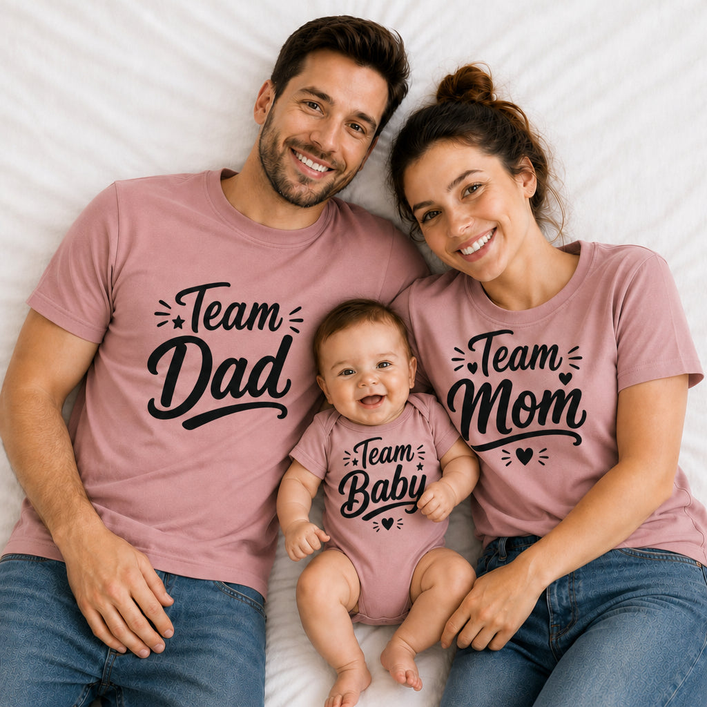 Dad mom and baby wearing Team Dad, Team Mom and Team Baby matching dusty rose family T-shirts.